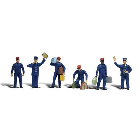 Train Personnel - HO Scale - Three Porters heft baggage while another stands empty-handed