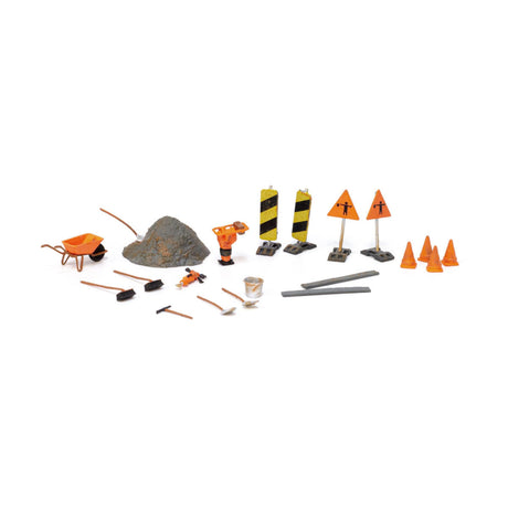 Road Crew Details - HO Scale - This set includes an assortment of Road Crew tools and supplies: warning signs, cones, a wheelbarrow, shovels, rakes, poles, a pile of ballast and a bucket