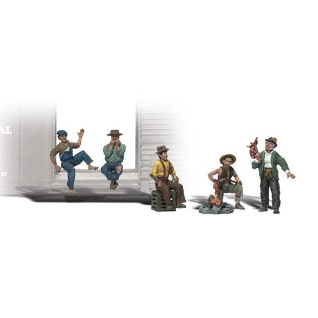 Hobos - HO Scale - A man sits, one plays his harmonica, another sits on a crate, another man roasts a hot-dog and the fifth stands with his knapsack hanging on a stick