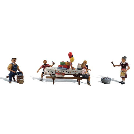 Backyard Birthday - HO Scale - Mom oversees the birthday festivities and excited children while Dad churns some fresh homemade ice cream!
Set contains 4 pieces