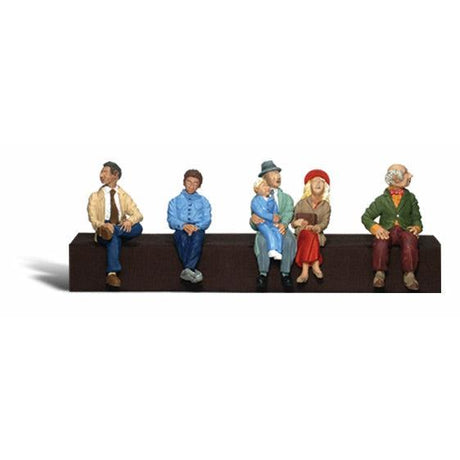 Passengers - HO Scale - A set of five figures in sitting position - three individual men, a mother and a father with child