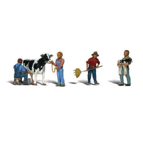Dairy Farmers - HO Scale - A set of three men, one woman and one Holstein cow